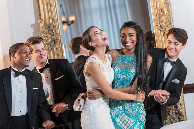 teens at a school formal after arriving in a bus